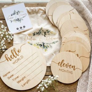 Close up of Personalized Laser Engraved Wooden Baby Name Disc